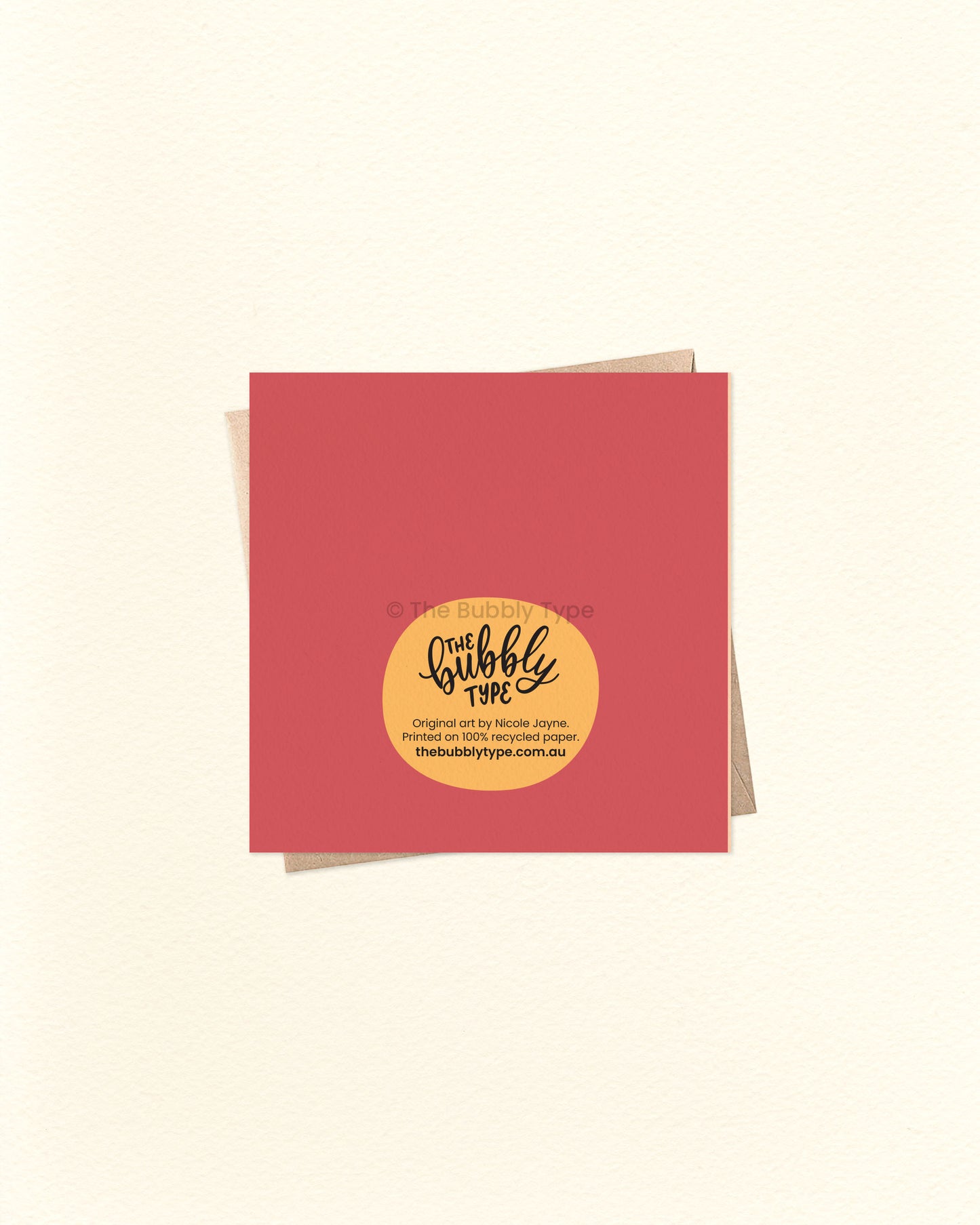 Back of the card with a maroon and yellow background, showing The Bubbly Type logo and print details. Shown with a kraft brown envelope. Designed and printed in Australia using eco-conscious materials.