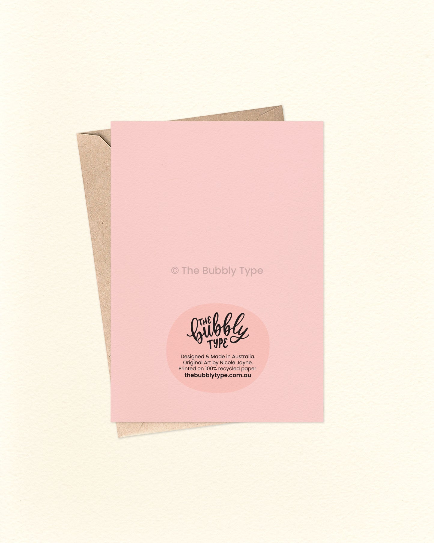 Back of the card with a matching pink background, featuring The Bubbly Type logo and card details. Displayed with a kraft brown envelope. Printed in Australia using eco-friendly materials.