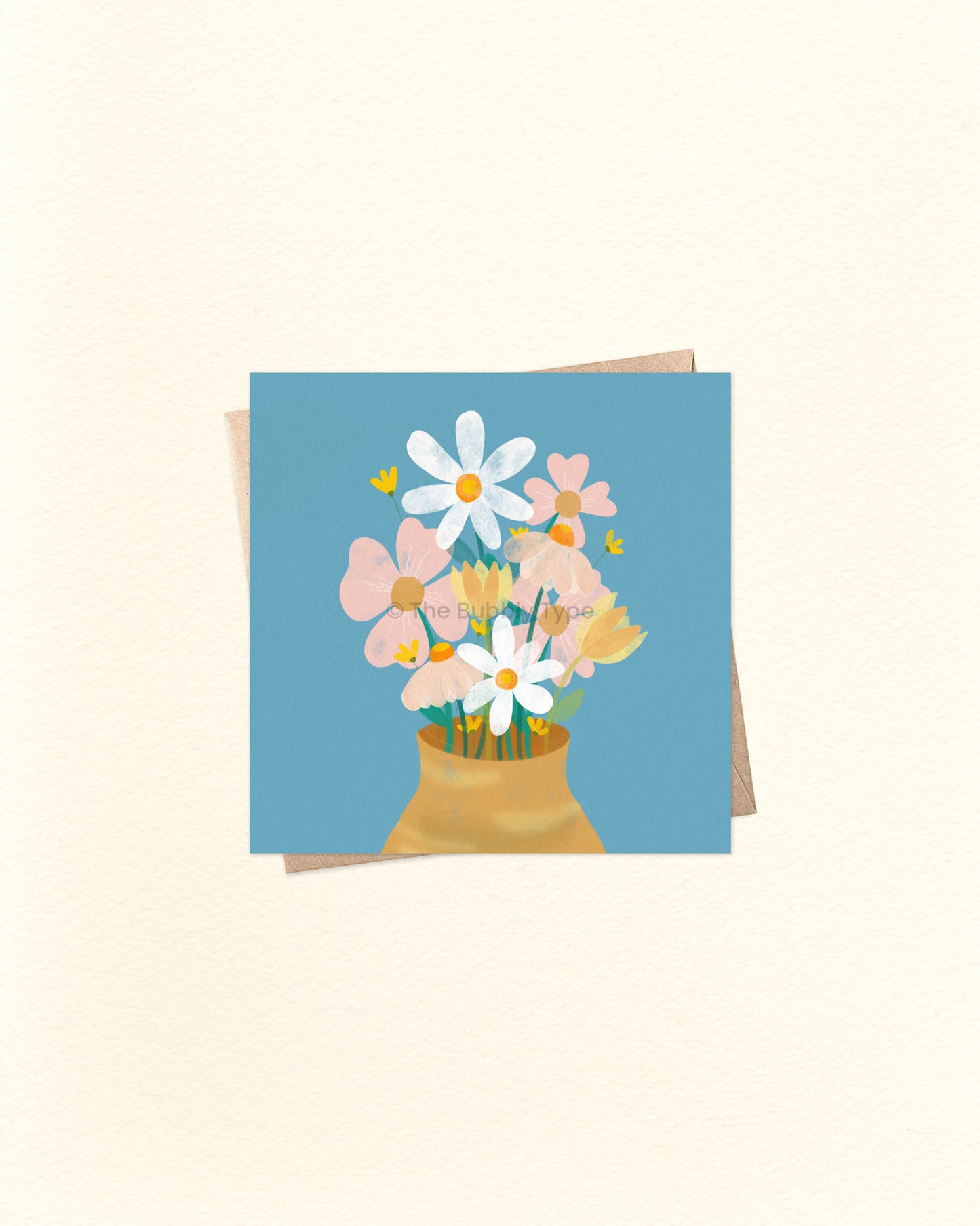 Square card with soft floral illustration and the words ‘Thinking of You’, laid on a brown kraft envelope. Buy unique sympathy or encouragement cards in Australia for friends going through tough times.