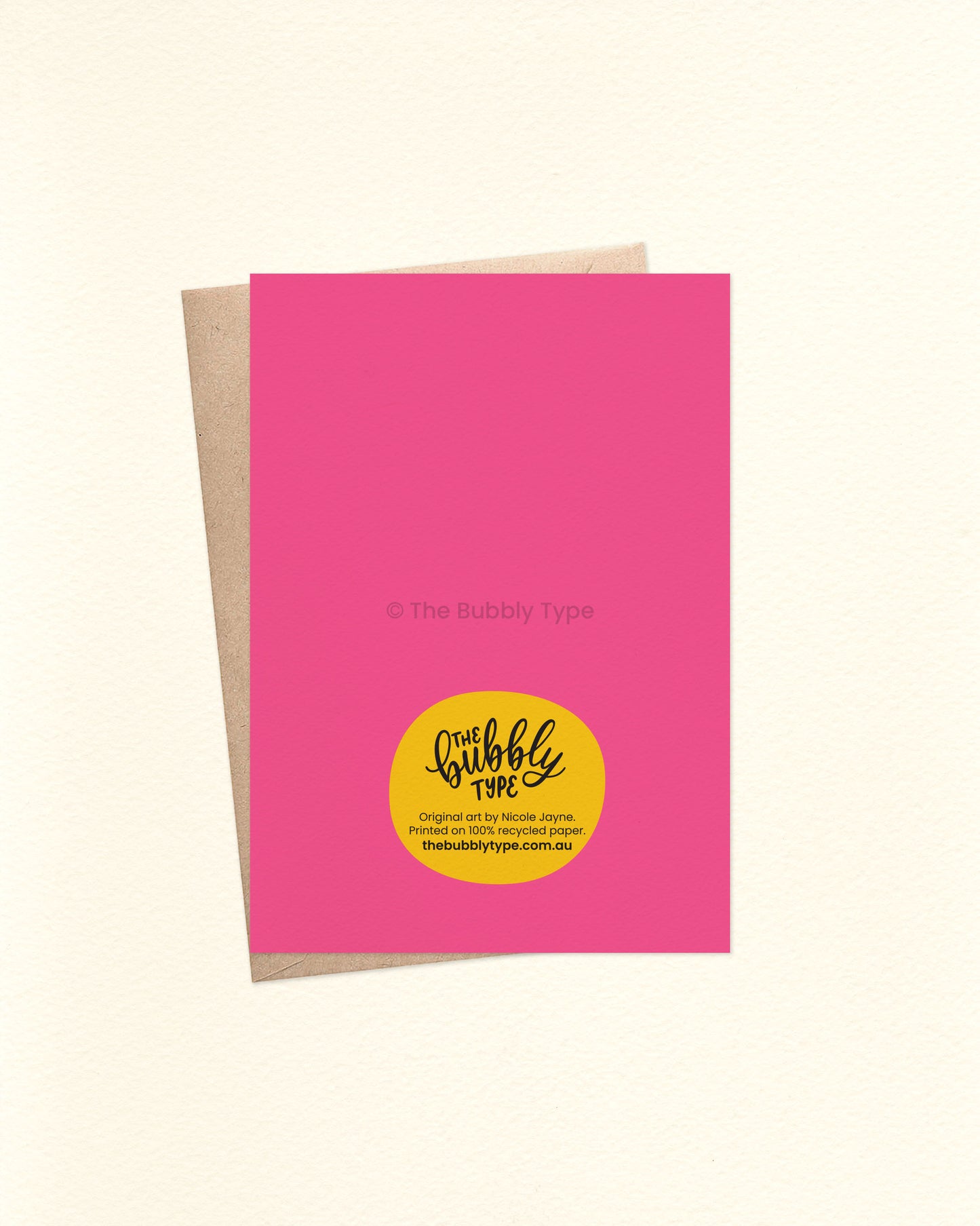 Back of the card is hot pink and features The Bubbly Type logo and card details. Shown with a kraft brown envelope. Printed on 100% recycled paper in Australia.