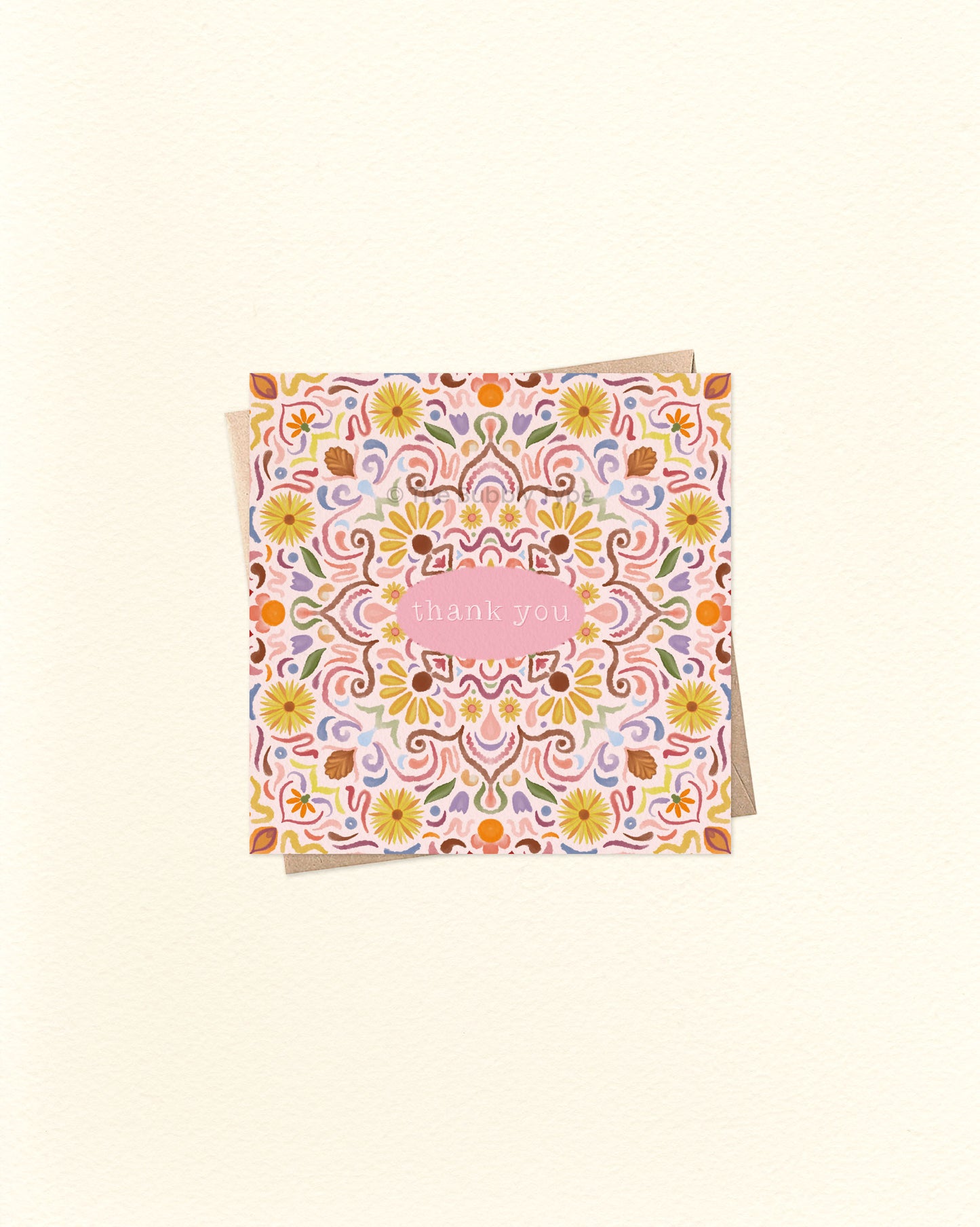 Front of 10cm square thank you card featuring a symmetrical tile-style watercolour pattern with “Thank You” written in the centre. Paired with a brown kraft envelope. Australian made card by The Bubbly Type – a colourful and heartfelt way to show appreciation.