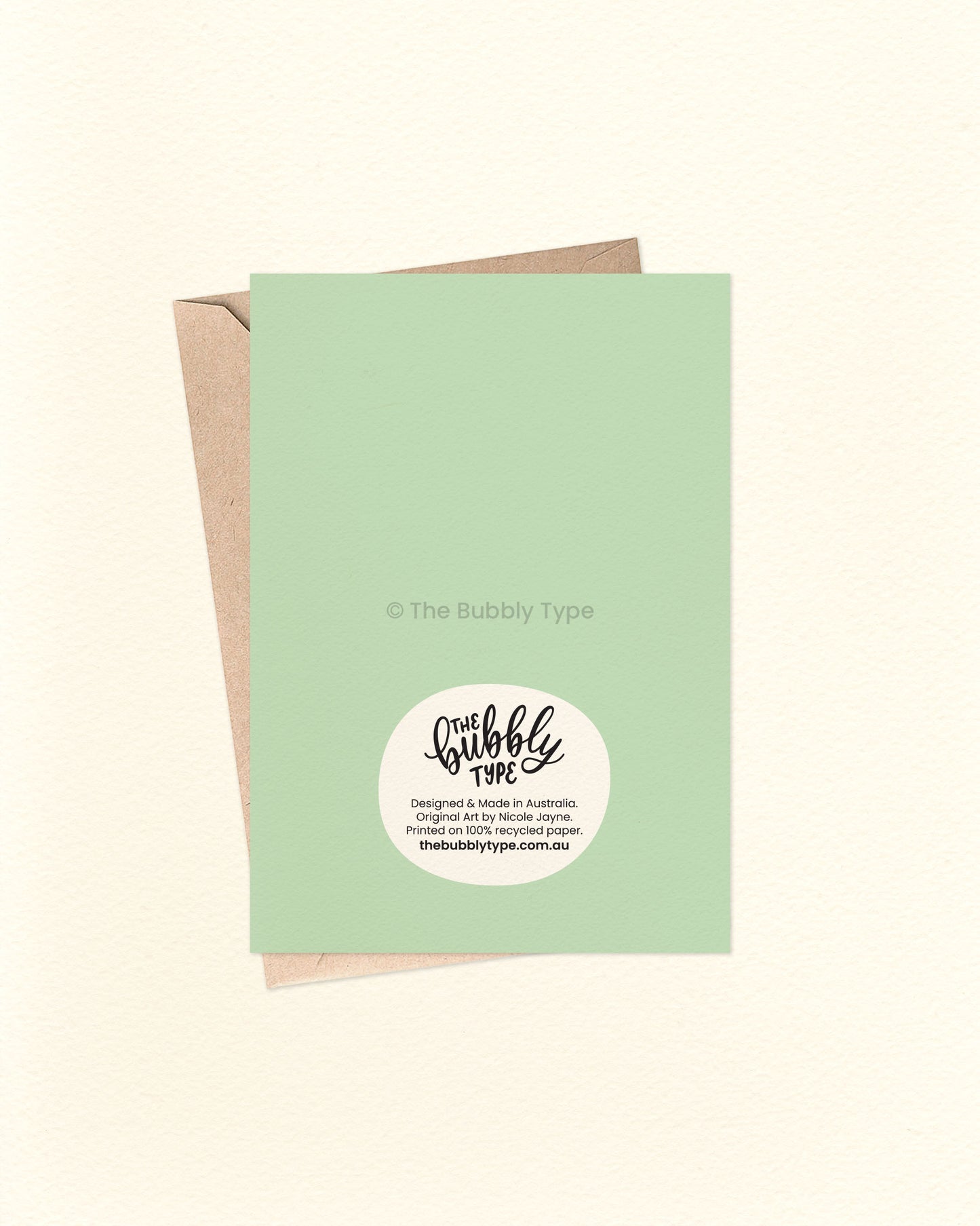 Back of the card with a matching green background, featuring The Bubbly Type logo and card details. Displayed with a kraft brown envelope. Designed and printed in Australia using sustainable materials.