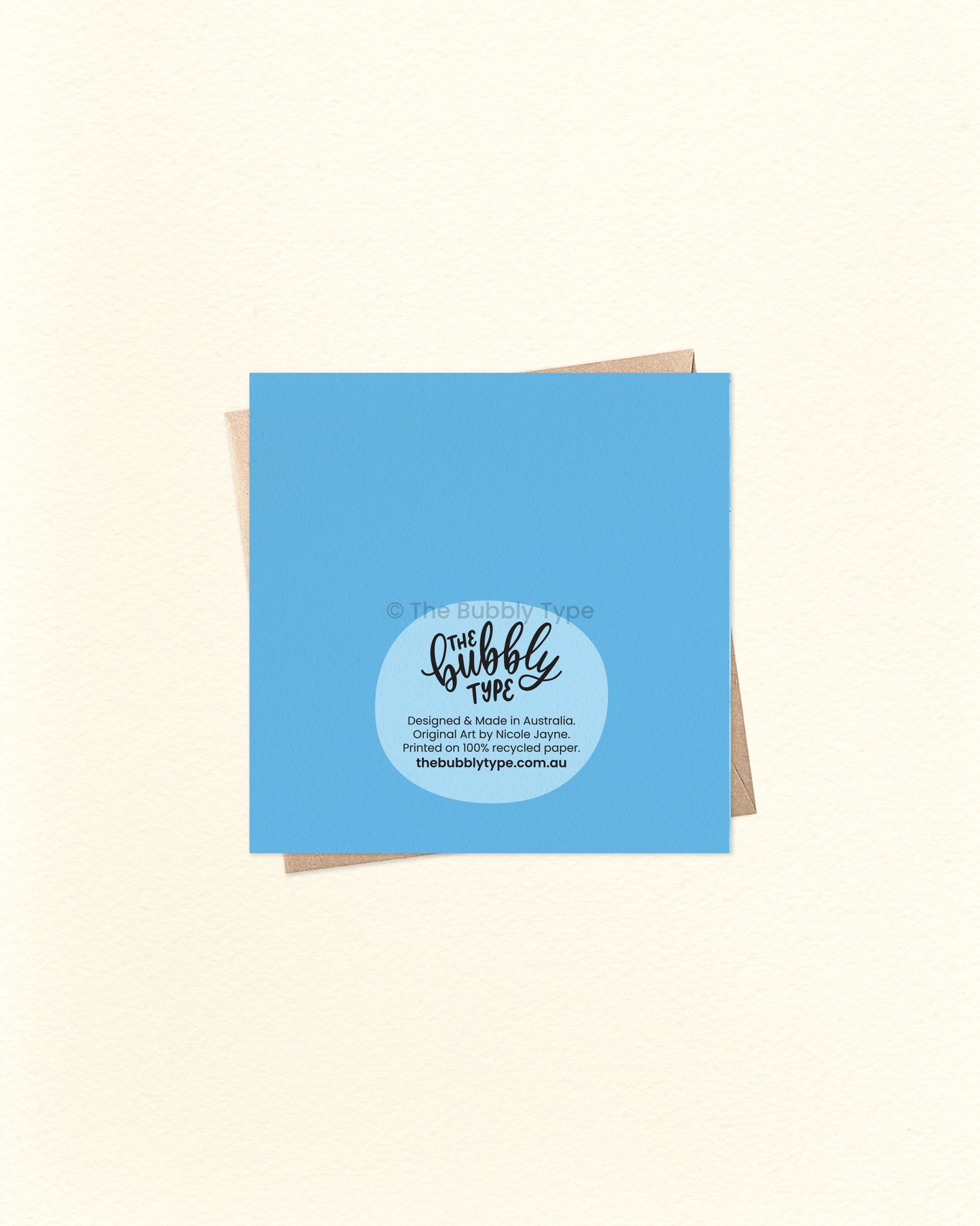 Back of the card with a solid blue background, featuring The Bubbly Type logo and print details. Displayed with a kraft brown envelope. Printed in Australia on eco-friendly cardstock.