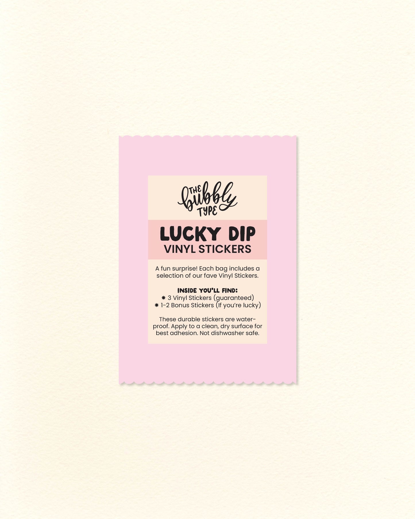 Photo of pink paper lucky dip bag with scalloped edges and a “Vinyl Sticker Lucky Dip” label showing what’s included. Surprise pack from The Bubbly Type featuring a random mix of fun, high-quality vinyl stickers. A cute, budget-friendly gift idea under $10.
