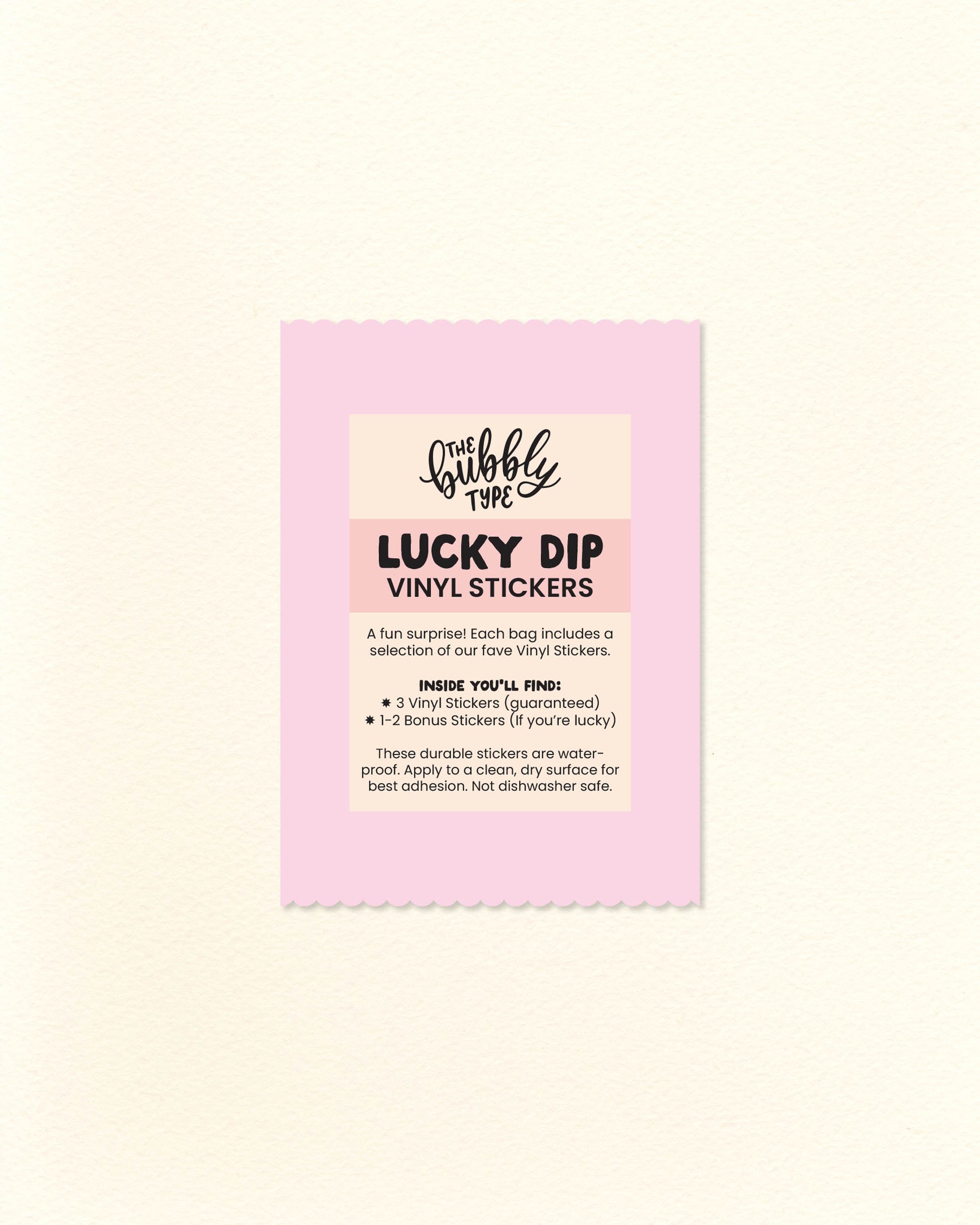 Photo of pink paper lucky dip bag with scalloped edges and a “Vinyl Sticker Lucky Dip” label showing what’s included. Surprise pack from The Bubbly Type featuring a random mix of fun, high-quality vinyl stickers. A cute, budget-friendly gift idea under $10.