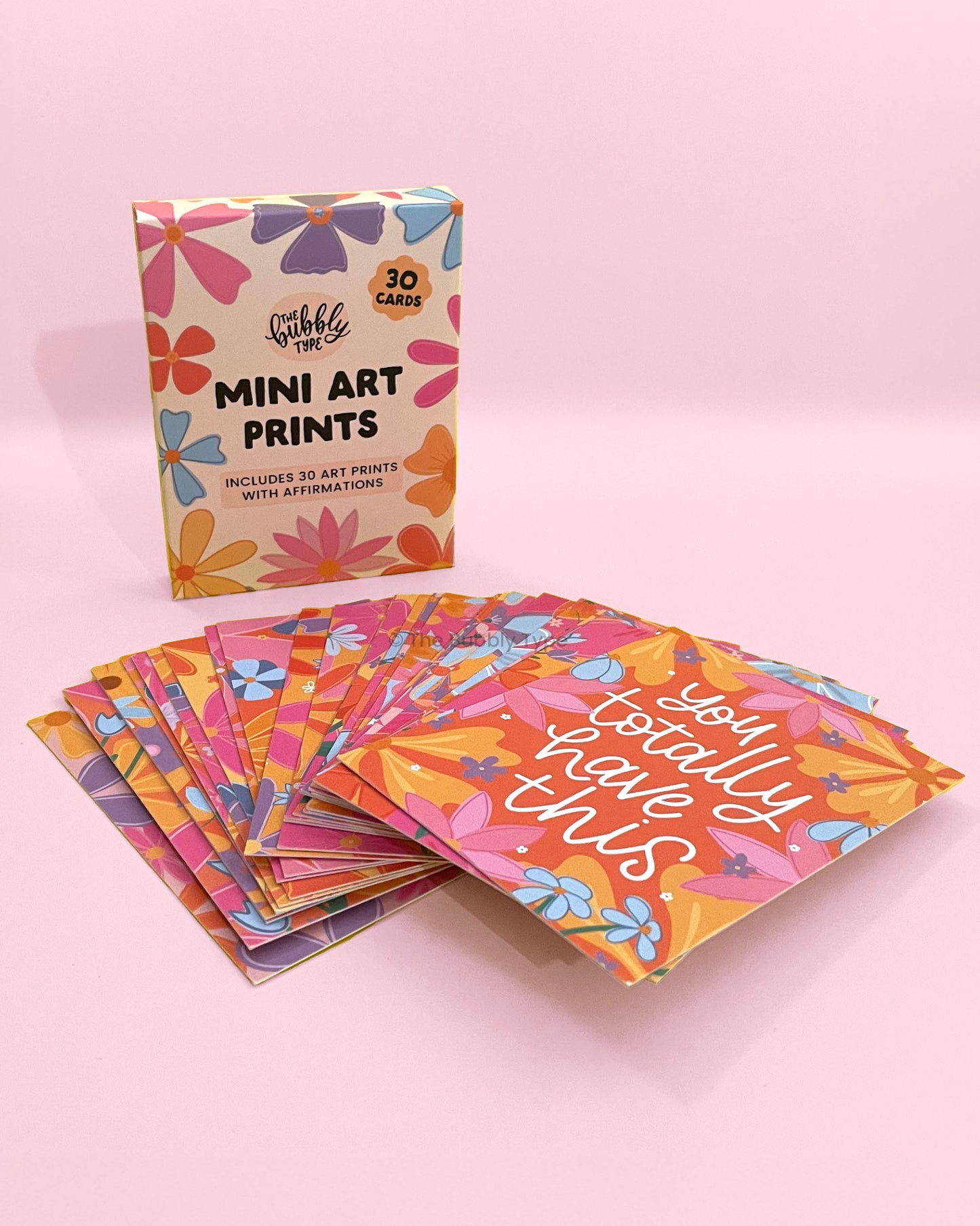Close up of motivational affirmation mini art prints featuring hand-lettered quotes and floral illustrations, eco-friendly stationery printed on recycled paper in Australia, perfect daily inspiration gift. Complete boxed set of 30 motivational affirmation mini art prints by The Bubbly Type, Australian made inspirational quotes with floral art, sustainable and thoughtful gift idea.