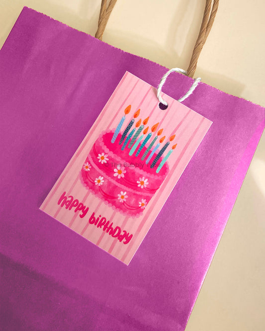 Birthday tag tied to a gift bag, showing how it elevates gift presentation. Buy fun and festive birthday tags in Australia for kids and adults.