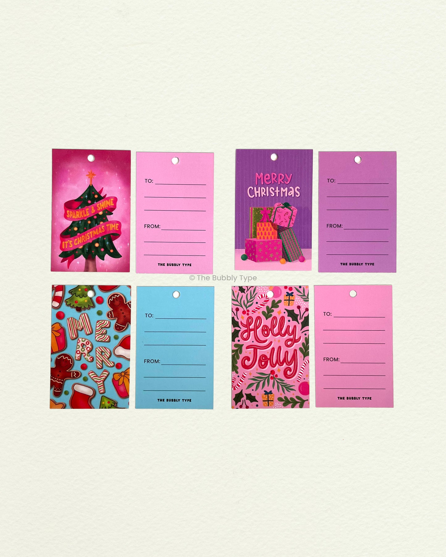 All four bubbly Christmas gift tag designs shown flat with front and back views. Features bold, modern Christmas illustrations with room to write. Great for fun gift wrapping ideas.