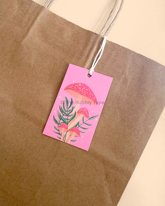 Mushroom gift tag attached to a gift bag. Adds a whimsical and natural vibe. Buy illustrated mushroom gift tags in Australia for plant or fungi lovers.