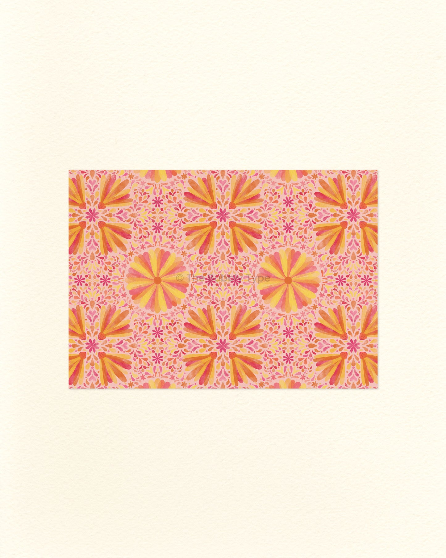 An A6 postcard featuring a pink and orange flower pattern design.