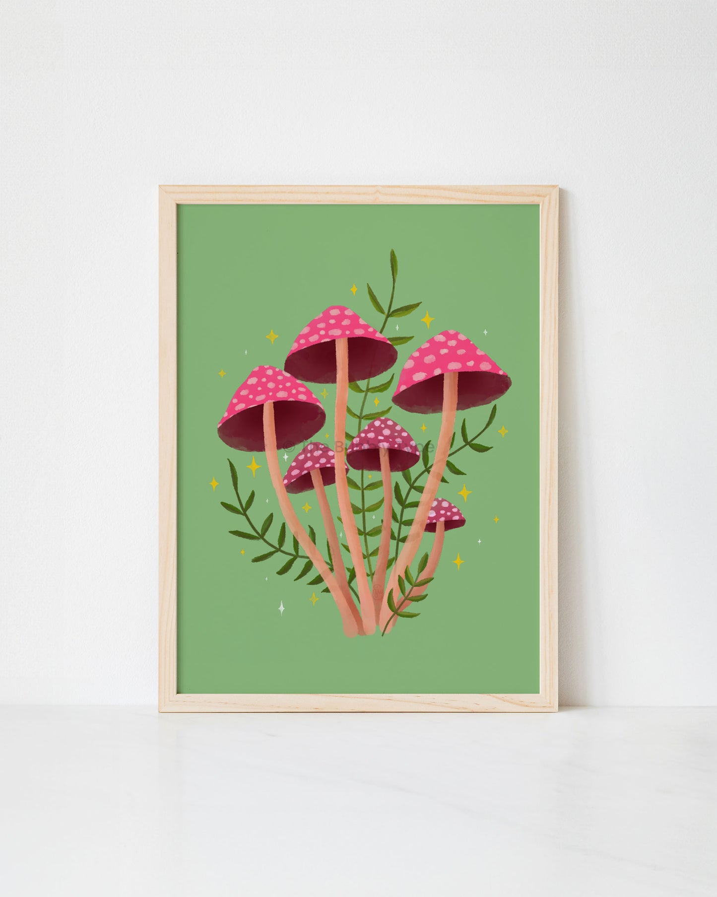 Framed artwork print of pink mushrooms on a green background