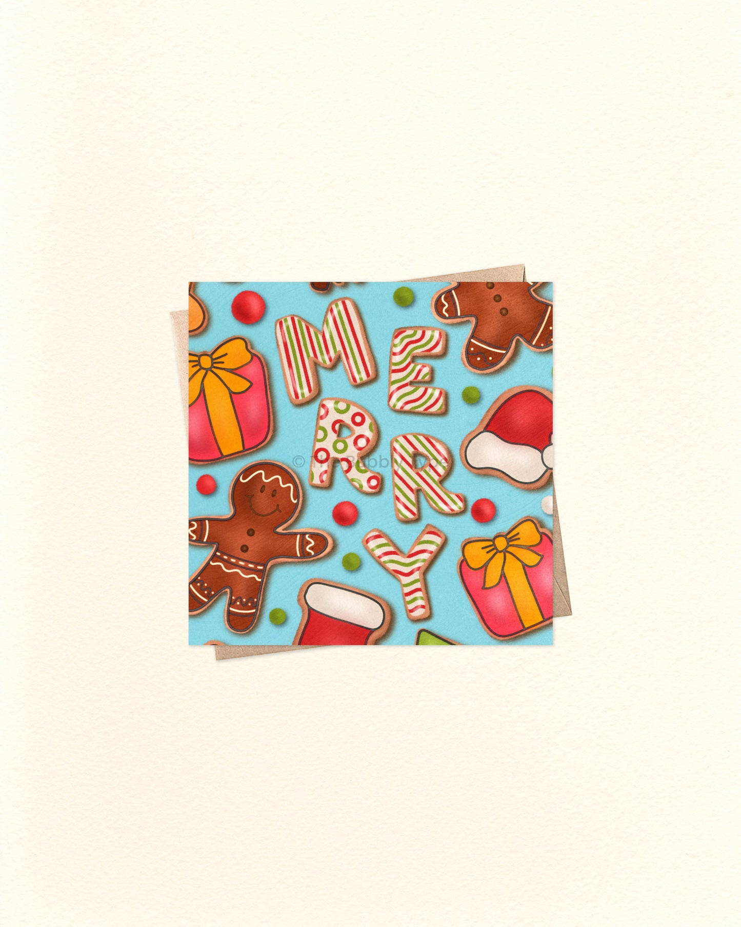 A blue square greeting card to celebrate Christmas. It has an illustration of gingerbread cookies in the shape of gingerbread men, presents, Santa hats and also spells the word "MERRY".