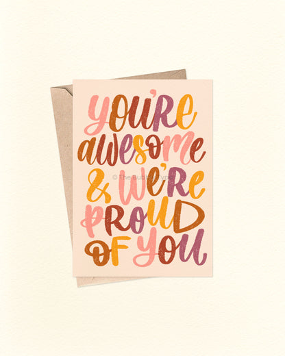 Front of A6 greeting card featuring whimsical hand-lettered text in bold warm colours including pink, brown, deep purple, and yellow, set against a pale cream background. Perfect for graduation, congratulations, or celebrating life’s big achievements. Shown with a brown kraft envelope. A joyful and uplifting Australian made card by The Bubbly Type.