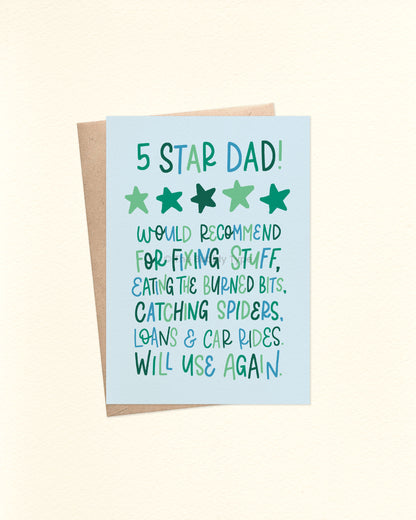 Front of A6 Father’s Day card with hand-lettered text that reads: “5 Star Dad. Would recommend for fixing stuff, eating the burned bits, catching spiders, loans and car rides. Will use again.” The playful mix of block and cursive lettering is in blues and greens on a pale blue background. Displayed with a brown kraft envelope.