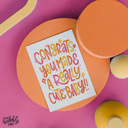 Back of the card with a matching cream background, featuring The Bubbly Type logo and card details. Displayed with a kraft brown envelope. Printed in Australia on eco-conscious materials.