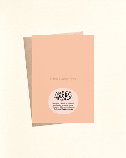 Back of the card with a pale peach background, displaying The Bubbly Type logo and card details. Shown with a kraft brown envelope. Perfect card for mother's day - printed on 100% recycled papers in Australia.