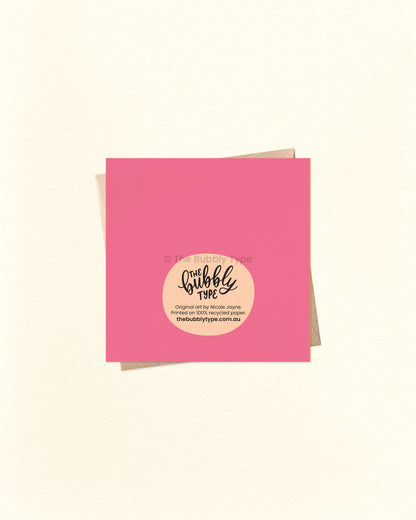 Back of the card with a pink background, featuring The Bubbly Type logo and print details. Shown with a kraft brown envelope. Proudly designed and printed in Australia.