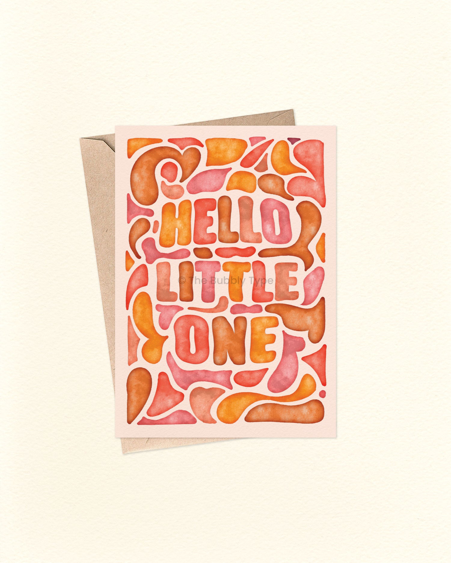 Front of A6 greeting card featuring a warm watercolour abstract design in yellows, oranges, and browns, with the hand-lettered message “Hello Little One” surrounded by soft flowy shapes. This Australian made card by The Bubbly Type is perfect for welcoming newborn babies and celebrating new parents. Shown with a brown kraft envelope.
