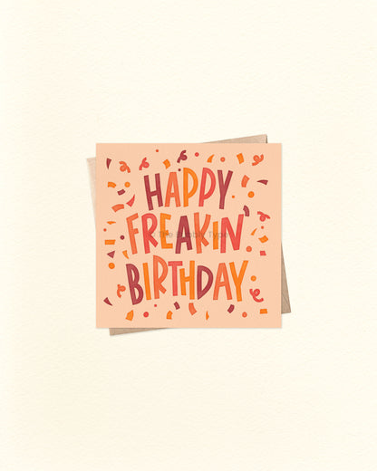 Front of 10cm square birthday card with bold, hand-lettered text that reads “Happy Freakin’ Birthday,” surrounded by colourful confetti. Features bright, warm colours – perfect for celebrating boys, men, or anyone with a fun sense of humour. Paired with a brown kraft envelope. Australian made card by The Bubbly Type.