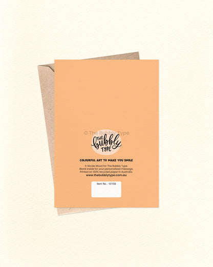 Back of the card with a bold orange background featuring The Bubbly Type logo and card details. Displayed with a kraft brown envelope. Printed in Australia on eco-conscious cardstock.