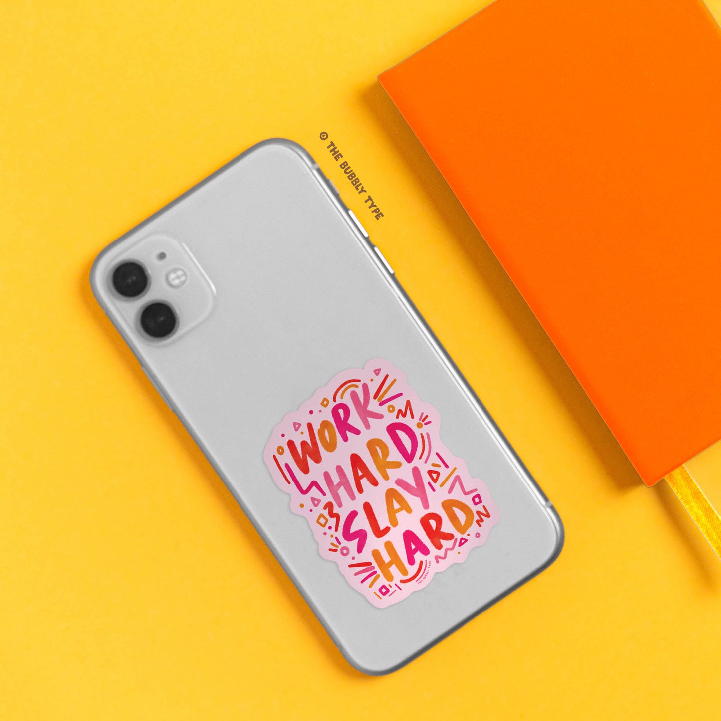 A vibrant vinyl sticker featuring the phrase "Work Hard Slay Hard" in playful hand-lettering, designed in bold pink and orange hues. Perfect for decorating laptops, notebooks, water bottles, and more, this high-quality vinyl sticker is made with durable, self-adhesive vinyl for long-lasting use. Printed on premium vinyl sticker paper, it’s waterproof and weather-resistant. Ideal for office spaces, study desks, or personalizing your workspace, this fun and motivational design is available to purchase in Aust