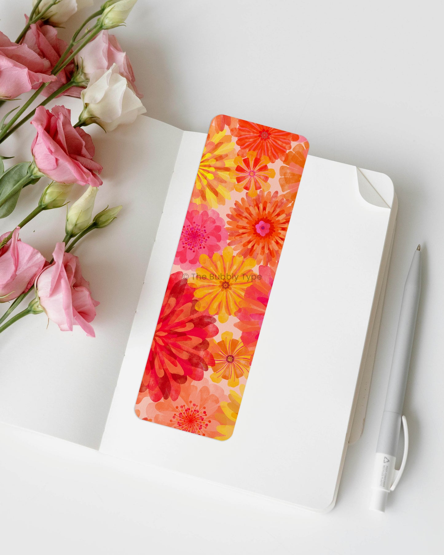 Botanical Bloom Bookmark – A Splash of Floral Joy – Bring a garden to your pages with this stunning watercolour floral bookmark, bursting with rich reds, playful pinks, and sunny yellows. The full-coverage floral design creates a lively, artistic look that’s perfect for lovers of botanical prints, flower art, and vibrant colour. Made from 100% recycled paper, this double-sided bookmark is durable, eco-friendly, and finished with rounded corners for a smooth feel. A gorgeous gift for any book lover!