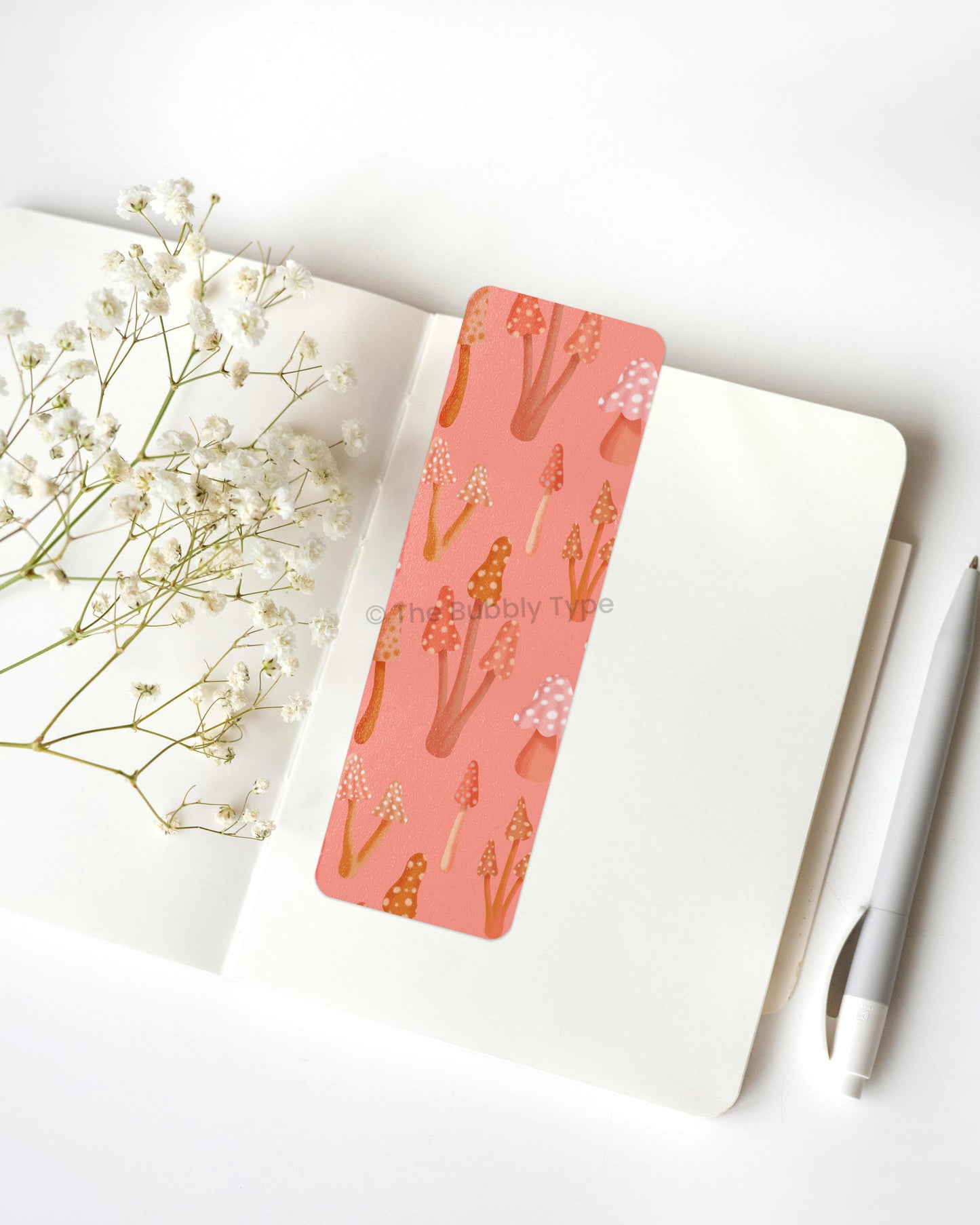 Woodland Mushroom Print Bookmark – Inspired by the beauty of the forest, this mushroom-themed bookmark features a delicate, hand-illustrated fungi pattern in a warm and earthy color palette. With soft browns, terracotta, and beige tones, it’s perfect for lovers of cottagecore, nature, and rustic charm. Made from 100% recycled paper, this double-sided bookmark is durable, eco-friendly, and finished with rounded corners for a smooth, elegant touch. The perfect companion for your next cozy read! 🍁📚🍄