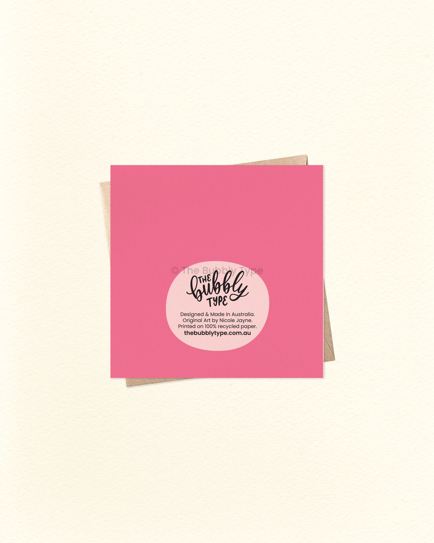 Back of the card with a pink background, featuring The Bubbly Type logo and print details. Shown with a kraft brown envelope. Printed sustainably in Australia.