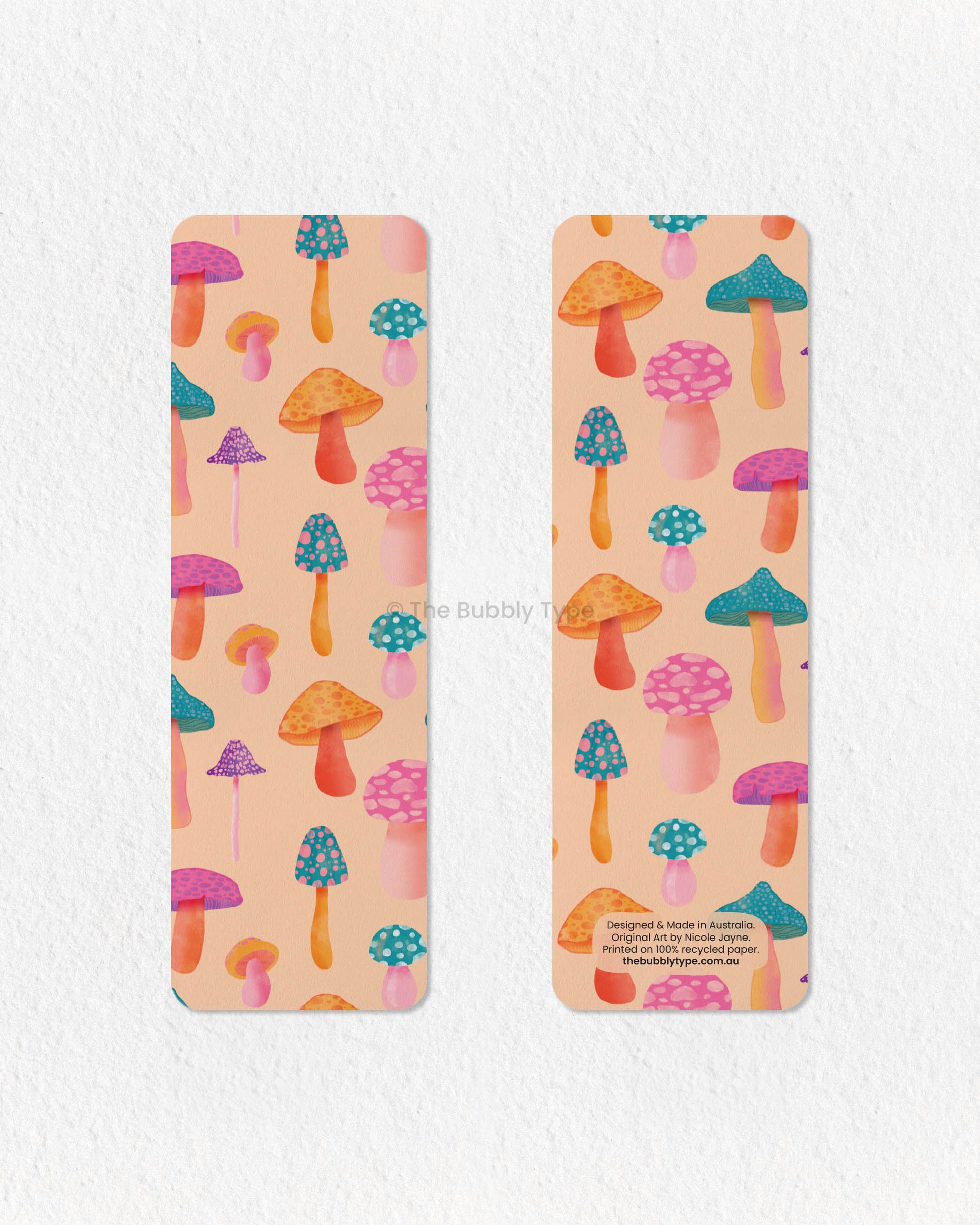 Psychedelic Mushroom Wonderland Bookmark 🍄🌈 – Step into a world of whimsy with this vibrant pale orange bookmark, bursting with a rainbow of colorful mushrooms! With its psychedelic-inspired design and bold, playful aesthetic, this bookmark is perfect for lovers of fun, funky, and retro vibes. Printed on 100% recycled paper, it’s double-sided, high-quality, and finished with rounded corners for a sleek touch. A must-have for anyone who loves mushrooms, magical forests, and groovy colours!