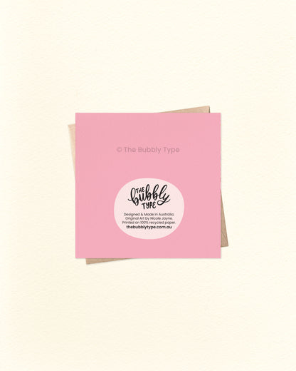 Back of the thank you card with pink background, displaying The Bubbly Type logo and print details. Printed in Australia on eco-friendly cardstock. Shown over a kraft brown envelope.