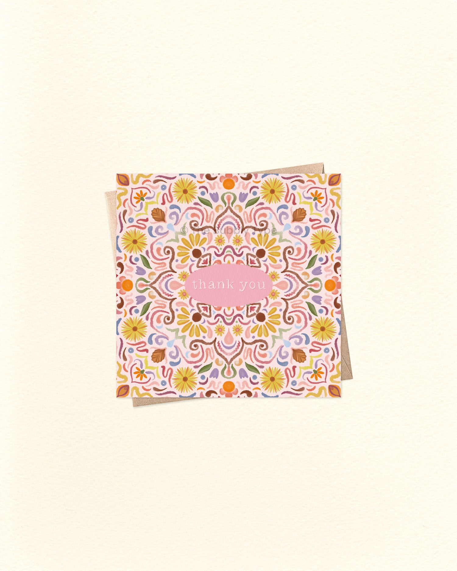Front of 10cm square thank you card featuring a symmetrical tile-style watercolour pattern with “Thank You” written in the centre. Paired with a brown kraft envelope. Australian made card by The Bubbly Type – a colourful and heartfelt way to show appreciation.