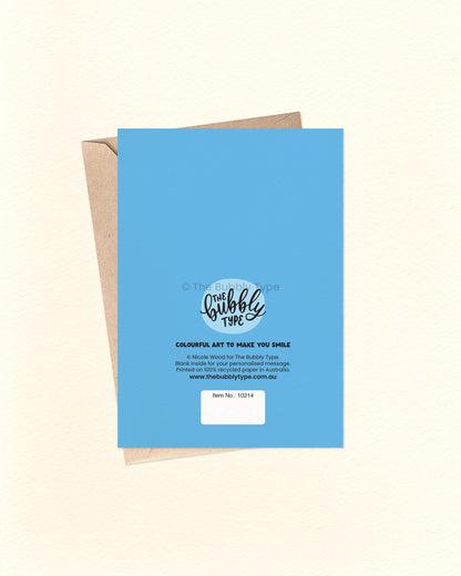 Back of the card with a solid blue background featuring The Bubbly Type logo and card details. Shown alongside a kraft brown envelope. Printed on eco-friendly cardstock.