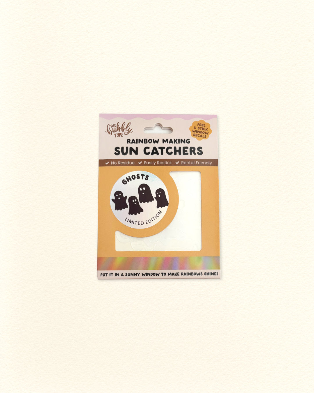Hang-sell packaging labeled 'Rainbow Making Sun Catchers' by The Bubbly Type. It has a holographic circular label with black bat and stars printed on it with the words 'GHOSTS' and 'LIMITED EDITION'. It's shown on a plain light background.