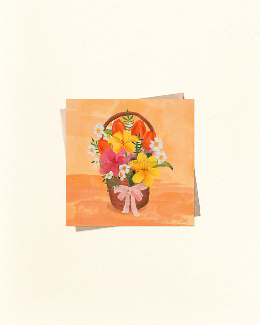 Square greeting card with hand-drawn illustration of a flower basket, perfect for thank you, birthday or thinking of you moments. Displayed over a brown kraft envelope. Buy floral greeting cards in Australia for any occasion.