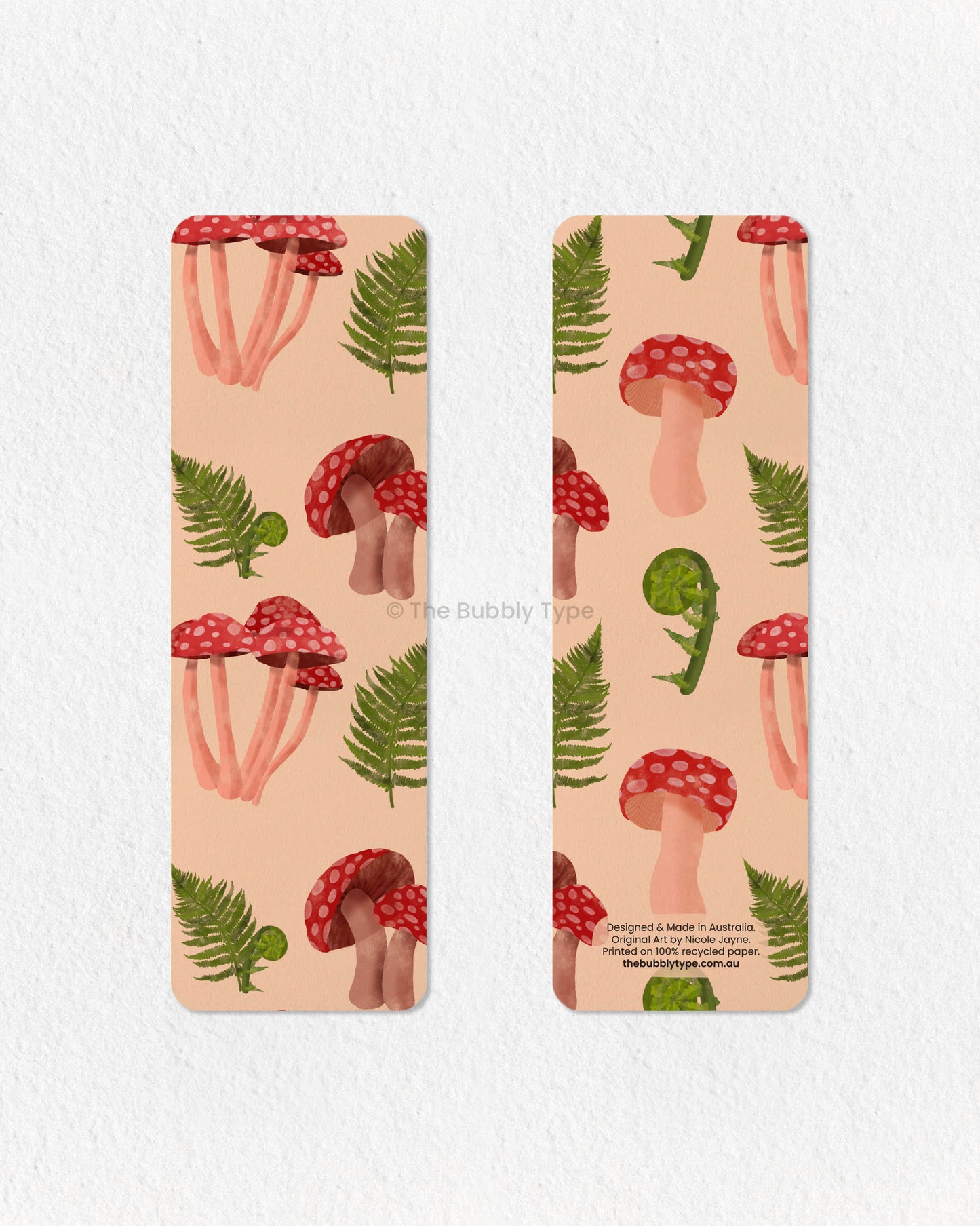 Nature-Inspired Fern & Mushroom Bookmark 🌱🍄 – Bring the beauty of the forest to your reading with this fern and mushroom-themed bookmark. Featuring delicate green ferns intertwined with bold red mushrooms, this design is perfect for lovers of woodland aesthetics and nature’s simple wonders. Made from 100% recycled paper, it’s double-sided, eco-friendly, and finished with rounded corners for a refined look. A lovely gift for book lovers with a passion for botanical art and earthy vibes!