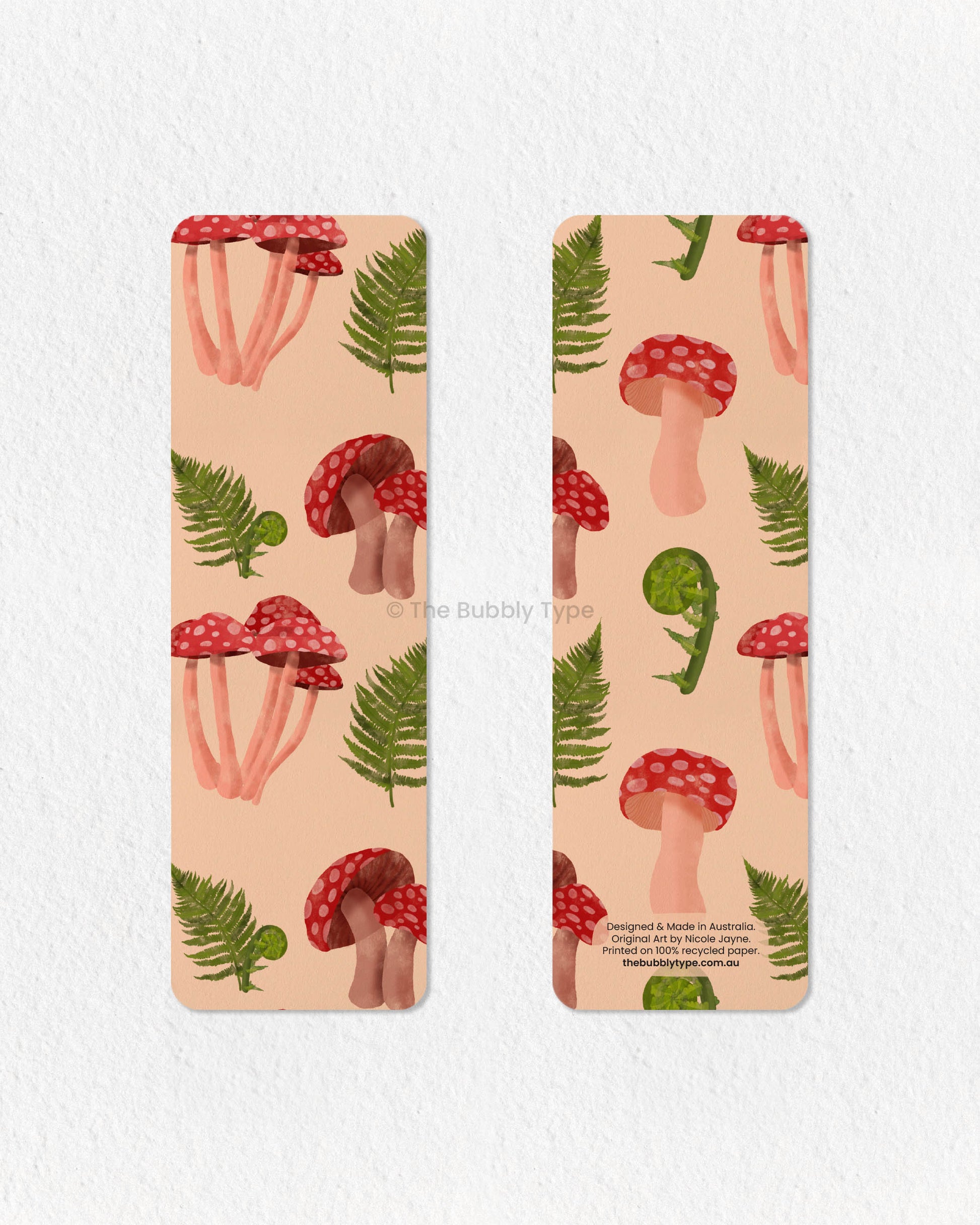 Nature-Inspired Fern & Mushroom Bookmark 🌱🍄 – Bring the beauty of the forest to your reading with this fern and mushroom-themed bookmark. Featuring delicate green ferns intertwined with bold red mushrooms, this design is perfect for lovers of woodland aesthetics and nature’s simple wonders. Made from 100% recycled paper, it’s double-sided, eco-friendly, and finished with rounded corners for a refined look. A lovely gift for book lovers with a passion for botanical art and earthy vibes!