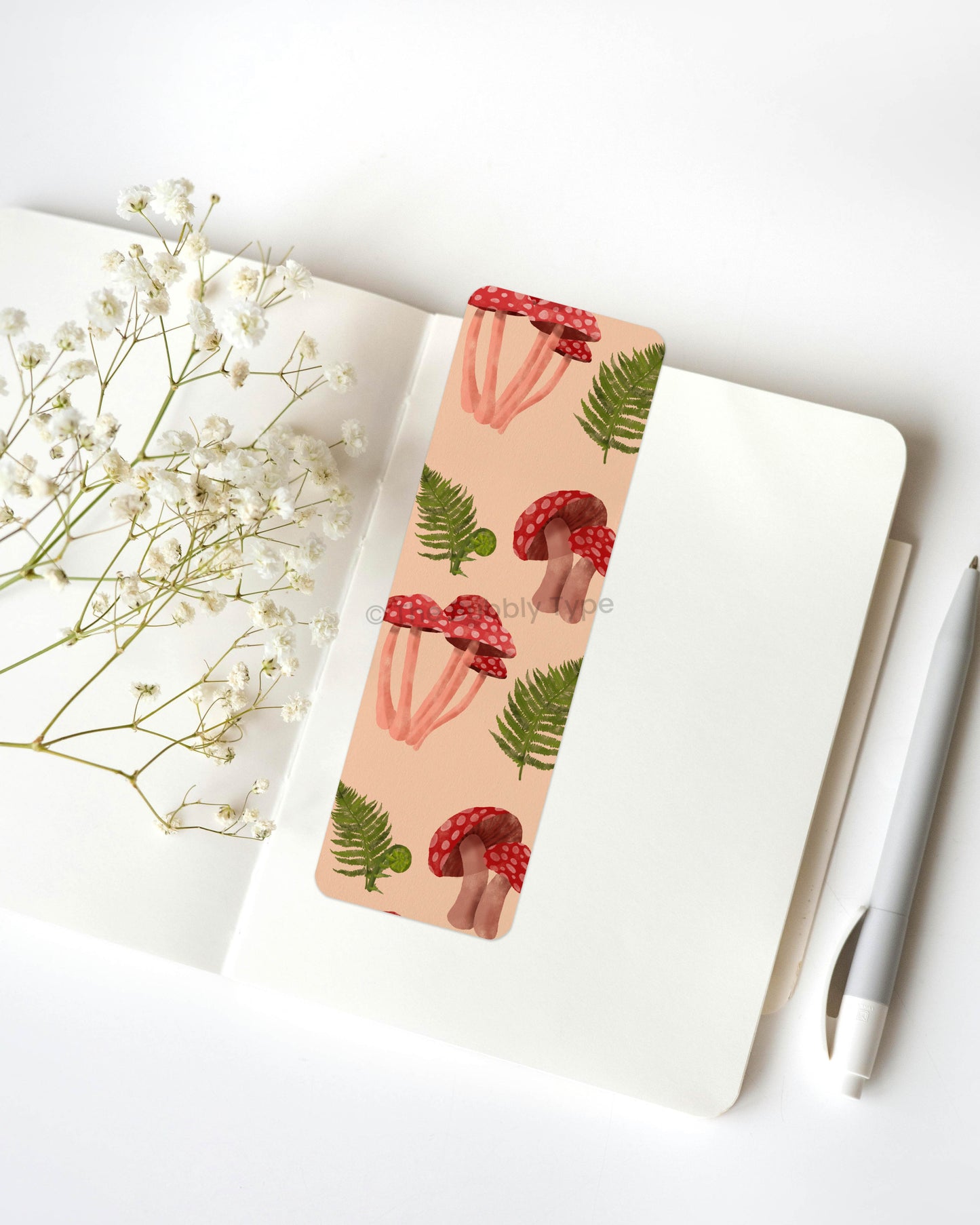 Fern & Mushroom Delight Bookmark 🍄🌿 – Step into nature with this stunning bookmark featuring a beautiful pattern of green ferns and vibrant red mushrooms! The perfect balance of earthy greenery and whimsical woodland charm, this design brings a touch of the forest to your pages. Printed on 100% recycled paper, it’s double-sided, high-quality, and finished with rounded corners for a smooth, elegant finish. A must-have for lovers of botanical beauty, mushrooms, and forest-inspired art! 🌿🍄📚