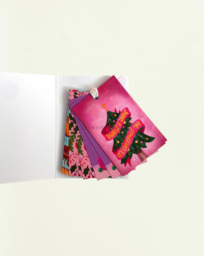 Open Bubbly Christmas tag pack with tags fanned out inside. Eye-catching colours and designs with string included. Ideal for creative gift-givers in Australia.