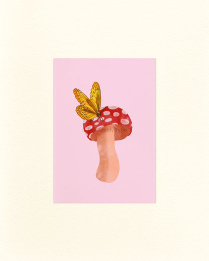 A portrait postcard with an illustration of a red cap mushroom with a yellow butterfly sitting on top, on a light pink background.