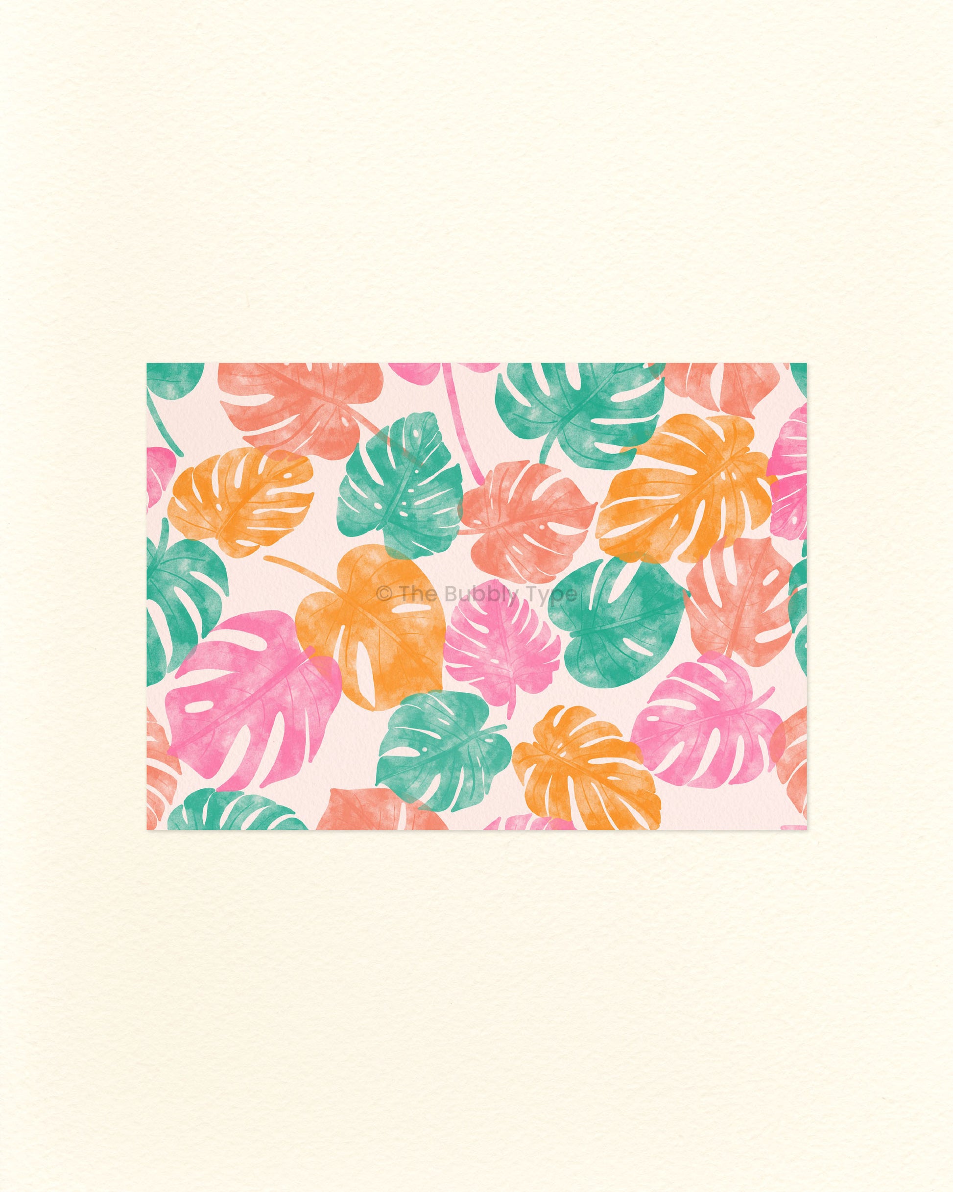 A postcard featuring a colourful tropical monstera leaf pattern on a pale pink background