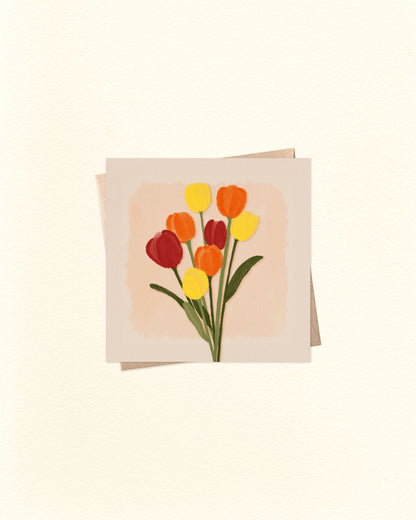 Greeting card with a design of red, yellow, and orange tulips on a beige background