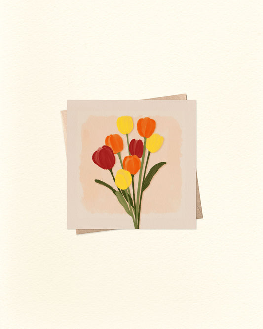 Greeting card with a design of red, yellow, and orange tulips on a beige background