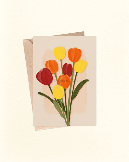 Greeting card with colourful tulips on a beige background