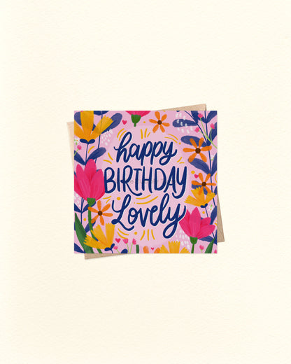 Birthday card with floral design and 'Happy Birthday Lovely' text on a light beige background