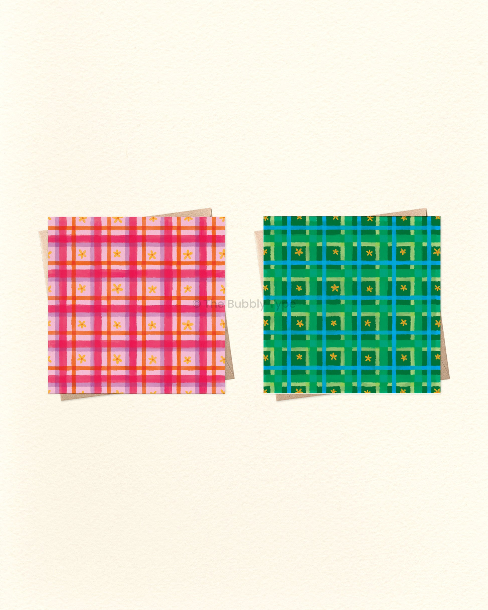 Two colourful plaid greeting cards on a beige background