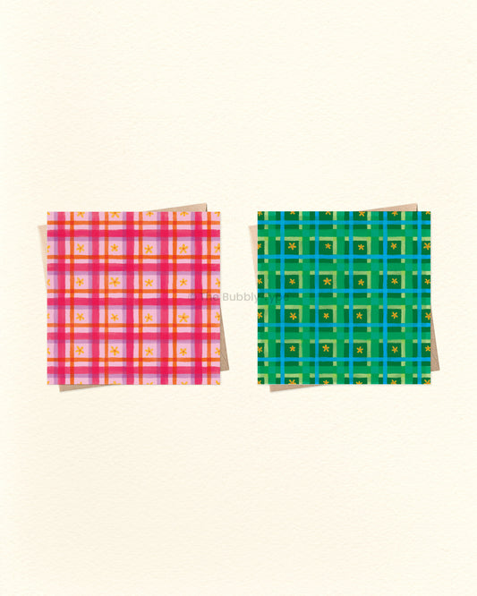 Two colourful plaid greeting cards on a beige background