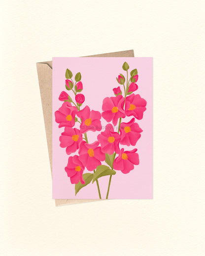 Greeting card with pink floral design on a light pink background