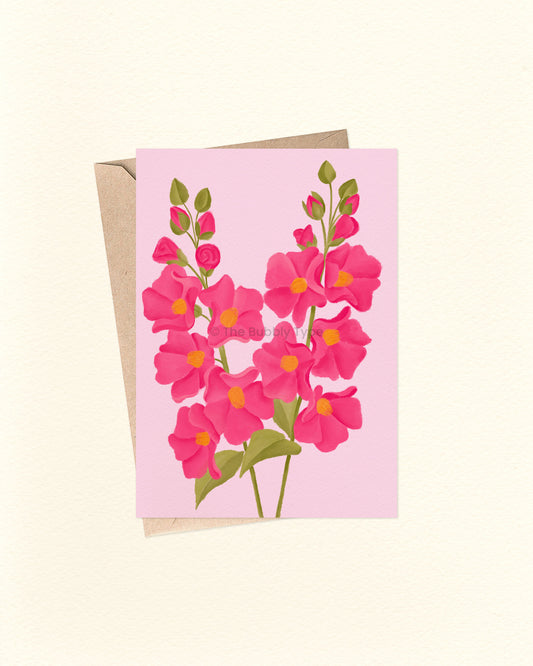 Greeting card with pink floral design on a light pink background