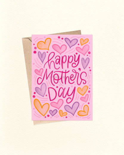 Greeting card with 'Happy Mother's Day' text and colorful hearts on a pink background.