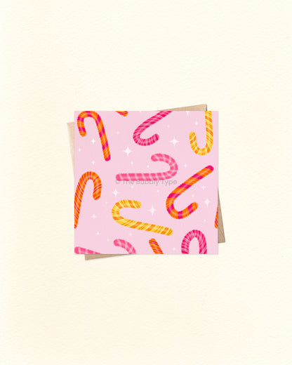 Pink, square card with colourful candy cane pattern with kraft brown envelope